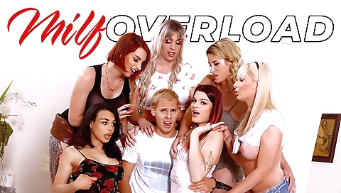 Two horny shemale sluts are playing with a guy's cock